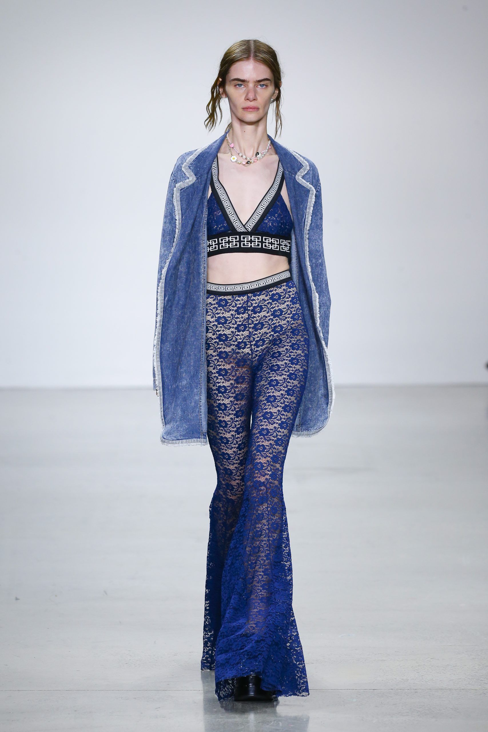 Female model with blue jacket and trousers at Metaverse, Past, Present, and Future SS23 show at New York Fashion Week 