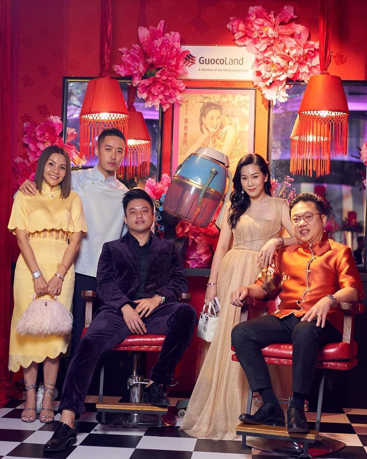 Guests pose with the GuocoLand Hair Salon backdrop at PINCNY2023 event
