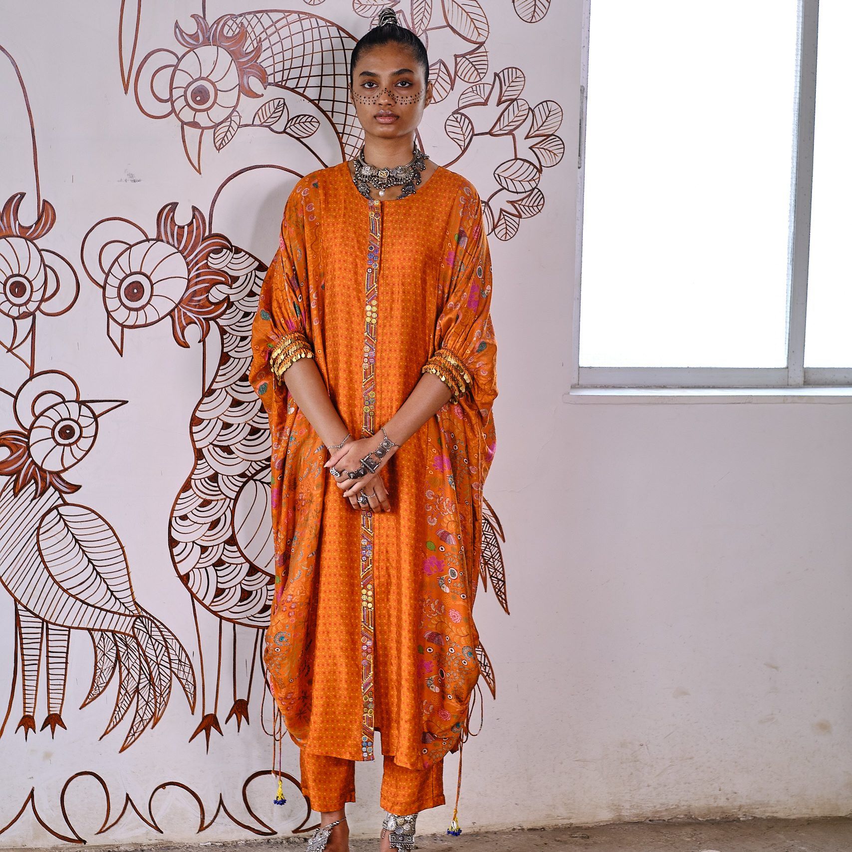 Sonam Luthria orange dress